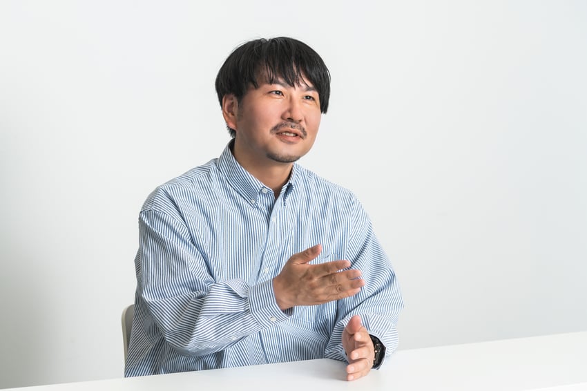 Akihiro Iihara of Pola Orbis discusses adopting NIST CSF for global security assessment during an interview.